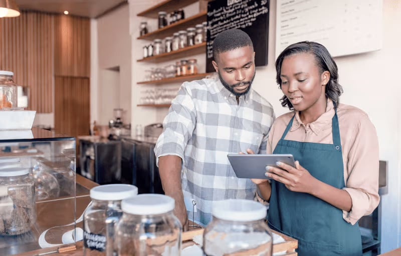 webimage-Two-young-African-entrepreneurs-working-at-their-cafe-counter